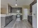 Charming kitchen featuring grey cabinets, stainless steel appliances, and modern countertop space at 1225 Berrywood Dr, Greenwood, IN 46143