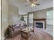 Comfortable living room with a fireplace and opening view into the kitchen at 1225 Berrywood Dr, Greenwood, IN 46143
