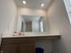 Bathroom featuring modern vanity, a large mirror, and plenty of counter space at 1256 Little Rodeo Pl, Greenwood, IN 46143