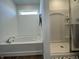 Bright bathroom featuring a soaking tub, separate shower, and modern fixtures at 1256 Little Rodeo Pl, Greenwood, IN 46143
