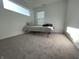 Bright bedroom featuring a large window allowing ample natural light, and neutral carpeting at 1256 Little Rodeo Pl, Greenwood, IN 46143