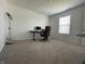 Bedroom with neutral carpet, a desk, and a comfortable chair creating a functional workspace at 1256 Little Rodeo Pl, Greenwood, IN 46143
