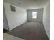Spacious bonus room with neutral carpet, recessed lights, and a window overlooking the neighborhood at 1256 Little Rodeo Pl, Greenwood, IN 46143