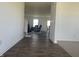 The home's entryway features sleek hardwood flooring and leads into a cozy living space at 1256 Little Rodeo Pl, Greenwood, IN 46143