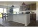 A modern kitchen with stainless steel appliances, an island, and an adjacent dining area for casual meals at 1256 Little Rodeo Pl, Greenwood, IN 46143