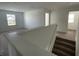 Open landing area with staircase access and views into adjacent rooms and backyard at 1256 Little Rodeo Pl, Greenwood, IN 46143