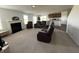 Spacious living area with a fireplace, and an open floor plan connecting to a modern kitchen at 1256 Little Rodeo Pl, Greenwood, IN 46143