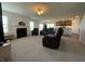 Expansive living room with fireplace, recessed lighting, and open floor plan to the kitchen, perfect for entertaining at 1256 Little Rodeo Pl, Greenwood, IN 46143