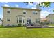 Spacious backyard featuring a well-manicured lawn and an inviting deck with outdoor seating at 1260 Easton Point Dr, Greenwood, IN 46142
