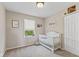 Cozy Bedroom features a crib, neutral tones and natural light at 1260 Easton Point Dr, Greenwood, IN 46142