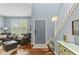 Inviting entryway with hardwood floors, neutral paint, and a staircase leading to the upper level at 1260 Easton Point Dr, Greenwood, IN 46142
