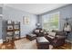 Cozy living room with hardwood floors, natural light, and comfortable seating arrangement at 1260 Easton Point Dr, Greenwood, IN 46142
