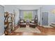 Cozy living room with hardwood floors, natural light, and comfortable seating arrangement at 1260 Easton Point Dr, Greenwood, IN 46142