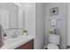 Modern powder room with white vanity, decorative mirror, and stylish accessories at 1260 Easton Point Dr, Greenwood, IN 46142