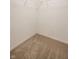 Empty closet with carpeted floor and white walls, providing ample storage space at 12922 St Andrews Way, Fishers, IN 46038