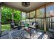 Comfortable screened porch with outdoor furniture, a ceiling fan, and views of the backyard at 12922 St Andrews Way, Fishers, IN 46038