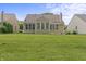 Green backyard with trimmed lawn and exterior view with well-manicured landscaping at 13172 Duval Dr, Fishers, IN 46037