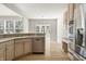 Kitchen with light-colored cabinetry, stainless steel appliances, and hardwood flooring at 13172 Duval Dr, Fishers, IN 46037