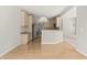 Open eat-in kitchen with wood floors, cabinets and stainless steel appliances at 13172 Duval Dr, Fishers, IN 46037