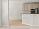 Eat-in kitchen featuring bar and view to living room at 13172 Duval Dr, Fishers, IN 46037