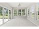 Bright sunroom with tile floor and many windows at 13172 Duval Dr, Fishers, IN 46037