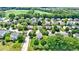 Aerial view of neighborhood with houses and green landscape with trees at 14754 Drayton Dr, Noblesville, IN 46062