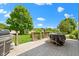 Back deck features a grill, beautiful green landscape, trees and outdoor dining area at 14754 Drayton Dr, Noblesville, IN 46062