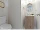 Updated half bathroom features wood vanity and updated fixtures at 14754 Drayton Dr, Noblesville, IN 46062