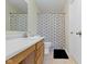 Clean bathroom featuring a vanity with wood cabinets and a shower with geometric patterned curtain at 14754 Drayton Dr, Noblesville, IN 46062