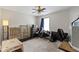 Bedroom with ceiling fan, gaming chairs, and pet carrier at 14754 Drayton Dr, Noblesville, IN 46062