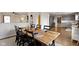 Elegant dining room featuring a large table with seating, modern decor, and an open view into the kitchen at 14754 Drayton Dr, Noblesville, IN 46062