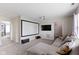 Living room with large sectional, projector, and movie screen at 14754 Drayton Dr, Noblesville, IN 46062