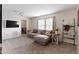 Cozy living room featuring a large sectional sofa and natural light at 14754 Drayton Dr, Noblesville, IN 46062
