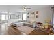 Inviting living room features a comfortable sectional, a ceiling fan, and decor, creating a warm and welcoming atmosphere at 14754 Drayton Dr, Noblesville, IN 46062