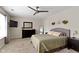 Spacious bedroom with a ceiling fan, wall decor, and neutral colors at 14754 Drayton Dr, Noblesville, IN 46062