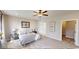 Calm bedroom featuring neutral tones, soft carpeting, decorative wall art, and ample natural light at 1550 Fox Hollow Dr, Martinsville, IN 46151