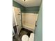 Bathroom features a standard white bathtub, toilet, and tiled floor at 1738 E 71St St, Indianapolis, IN 46220