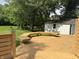 Expansive wood deck showcasing built-in bench seating and a view of the lush, green backyard at 1738 E 71St St, Indianapolis, IN 46220