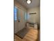 Bright entryway with front door, coat rack, storage bench, and bamboo floors at 1738 E 71St St, Indianapolis, IN 46220