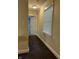 Hallway featuring neutral walls and trim, leading to a bedroom, with carpet at 1738 E 71St St, Indianapolis, IN 46220