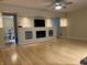 Spacious living room with hardwood floors, fireplace, and built-in shelving for entertainment at 1738 E 71St St, Indianapolis, IN 46220