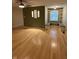 Spacious living room with hardwood floors, built in shelving, and a ceiling fan at 1738 E 71St St, Indianapolis, IN 46220