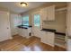 Bright mud room with beautiful wood floors, built-in storage and coat rack at 1738 E 71St St, Indianapolis, IN 46220