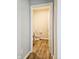 A half bathroom features a standard toilet and wood-look flooring at 1932 Downey Ln, Greenfield, IN 46140