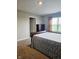 Neutral bedroom featuring carpet, natural light, and a dark wood dresser, providing a comfortable retreat at 1932 Downey Ln, Greenfield, IN 46140