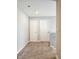 Upstairs hallway with carpet and white doors leading to other rooms; spacious upper level at 1932 Downey Ln, Greenfield, IN 46140