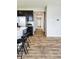 Modern kitchen with stainless steel appliances, a breakfast bar, and an inviting hallway at 1932 Downey Ln, Greenfield, IN 46140