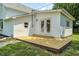 Wooden back deck with double doors to the house provides outdoor enjoyment at 209 Howard Ave, Arcadia, IN 46030