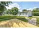Large wood deck overlooking a spacious backyard with a detached garage at 209 Howard Ave, Arcadia, IN 46030