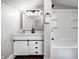 This bathroom features a modern vanity, black accents, and a shower/tub combination at 209 Howard Ave, Arcadia, IN 46030